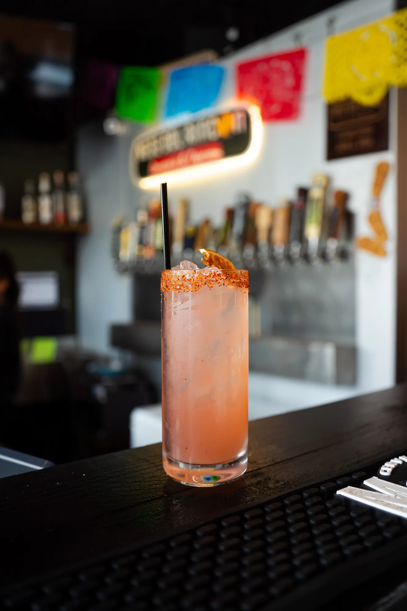 Handcrafted cocktail with a chili-salt rim on the Mesa del Rincon bar
